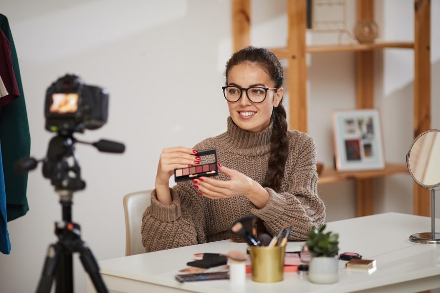 Smiling Young Woman Testing Make up Products for Video